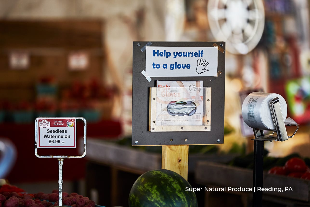 Super Natural Product | Reading, PA sign saying 'help yourself to a glove' at super natural produce store in reading, pa